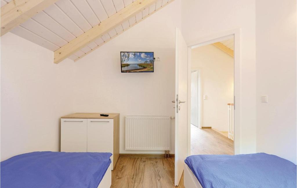 Postel nebo postele na pokoji v ubytování Ferienhausdorf Thale