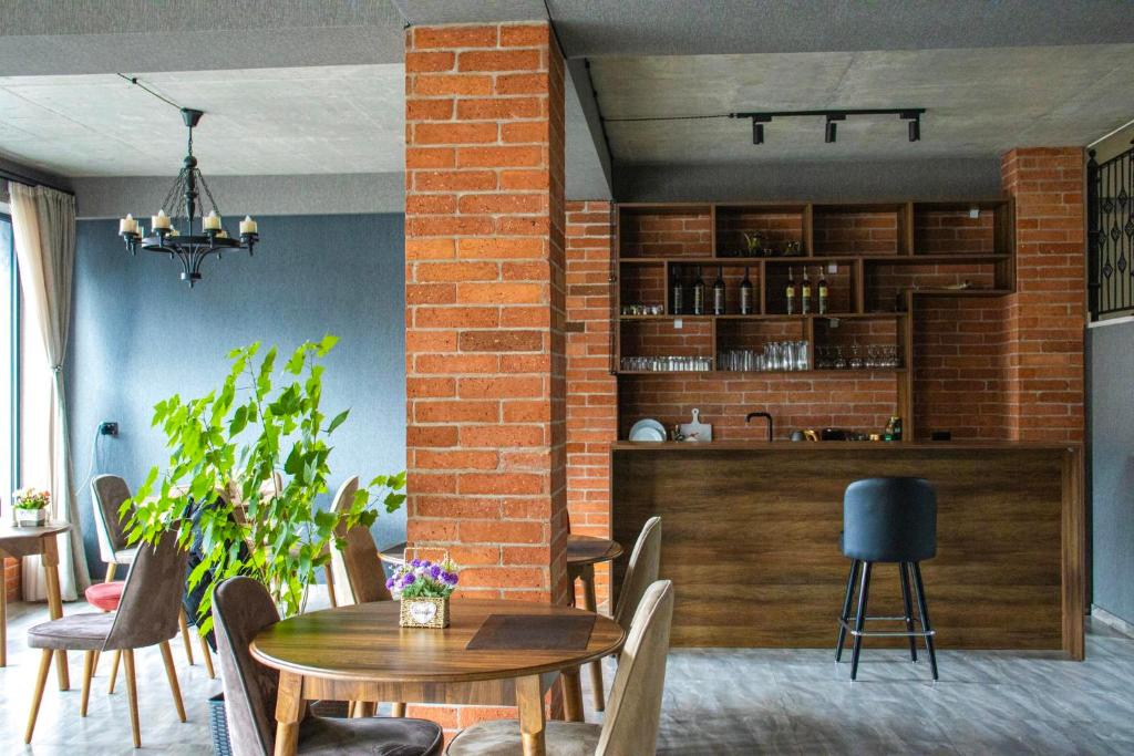 a dining room with a table and chairs at Best view Kazbegi in Stepantsminda