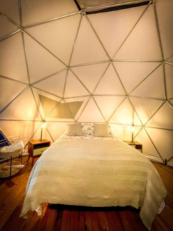 Postel nebo postele na pokoji v ubytování La Chagra VIP - Glamping en Villavicencio