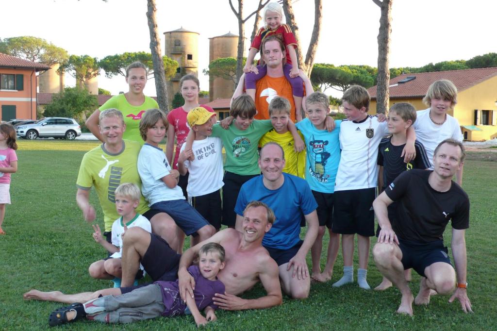 a group of people posing for a picture at La Fattoria di Tirrenia in Tirrenia
