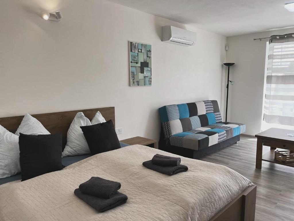 Postel nebo postele na pokoji v ubytování Apartmány u Romany