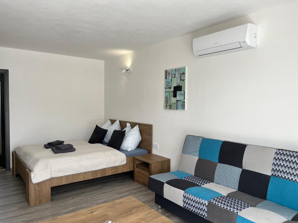 Postel nebo postele na pokoji v ubytování Apartmány u Romany