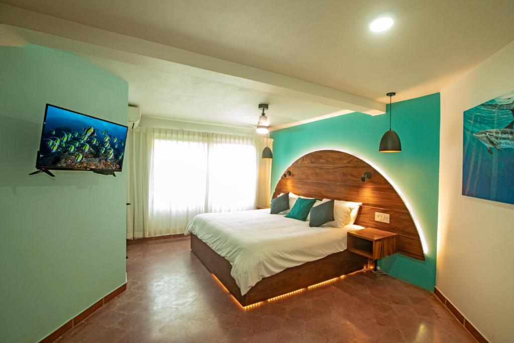 Кровать или кровати в номере Hotel El Velero