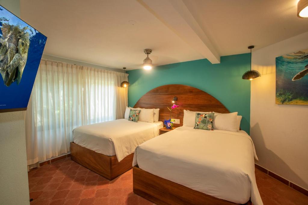 Кровать или кровати в номере Hotel El Velero