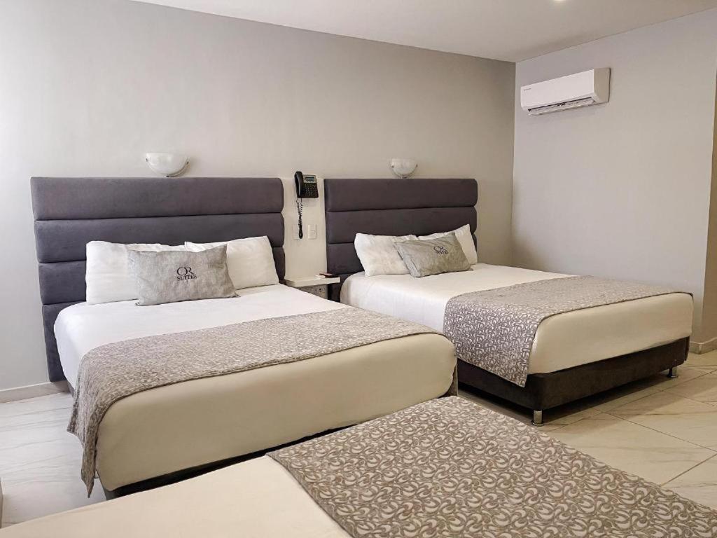 Postel nebo postele na pokoji v ubytování Hotel OR Suite