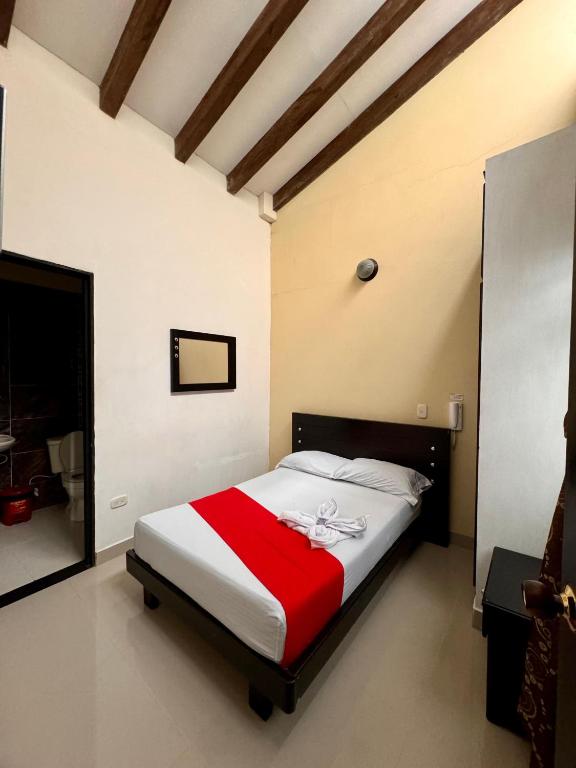 Postel nebo postele na pokoji v ubytování Hotel Portal Dorado