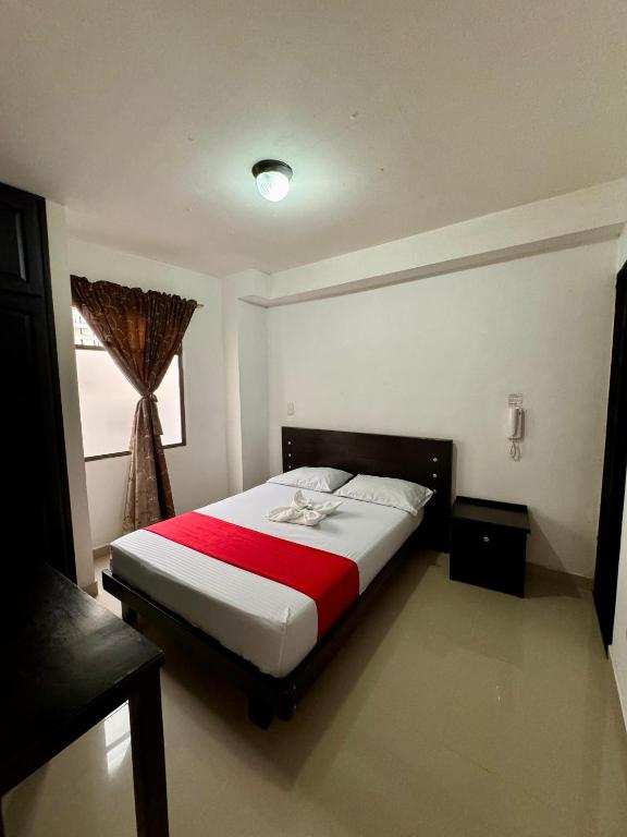Postel nebo postele na pokoji v ubytování Hotel Portal Dorado