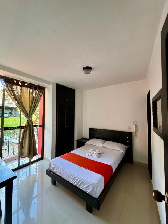 Postel nebo postele na pokoji v ubytování Hotel Portal Dorado