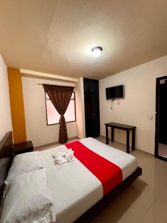 Postel nebo postele na pokoji v ubytování Hotel Portal Dorado
