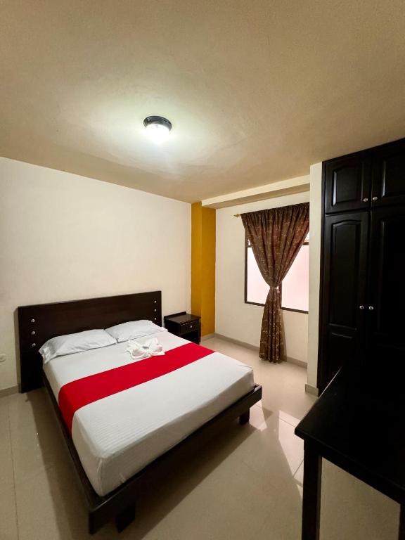Postel nebo postele na pokoji v ubytování Hotel Portal Dorado