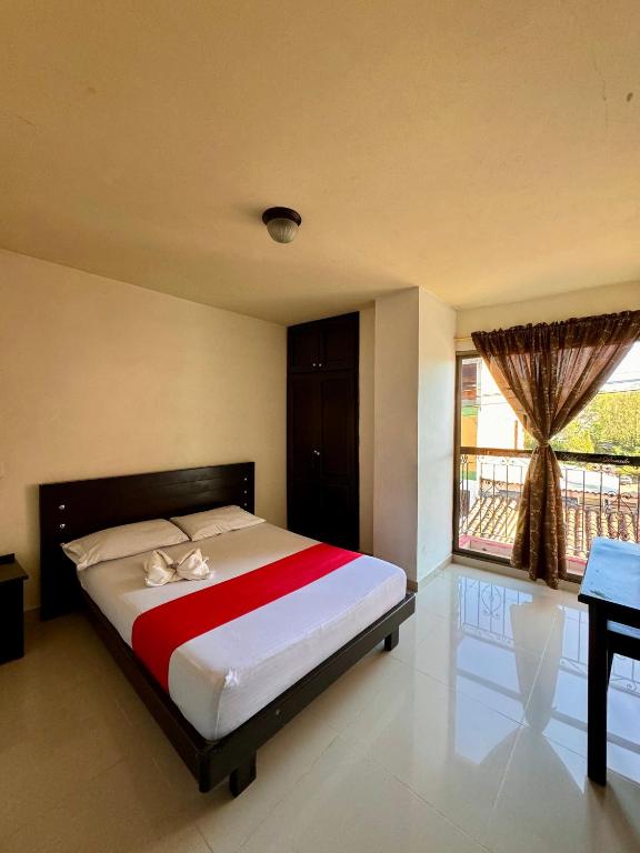 Postel nebo postele na pokoji v ubytování Hotel Portal Dorado