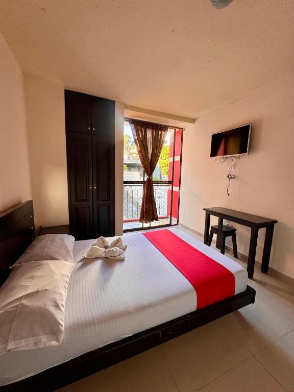 Postel nebo postele na pokoji v ubytování Hotel Portal Dorado