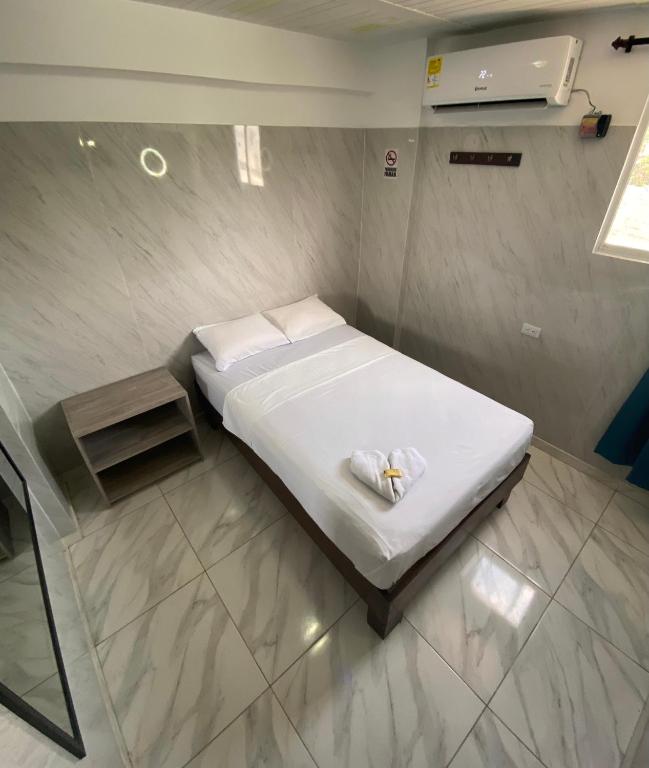 Postel nebo postele na pokoji v ubytování Hotel Rancho Grande
