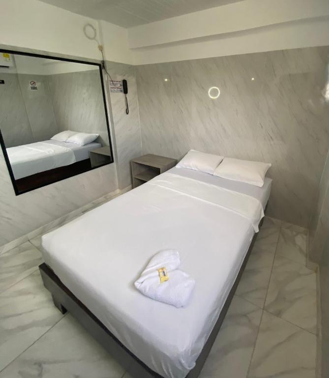 Postel nebo postele na pokoji v ubytování Hotel Rancho Grande