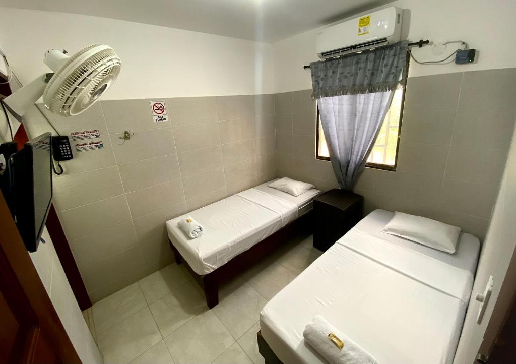 Postel nebo postele na pokoji v ubytování Hotel Rancho Grande