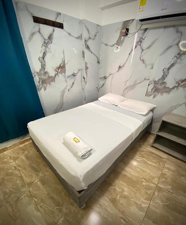 Postel nebo postele na pokoji v ubytování Hotel Rancho Grande