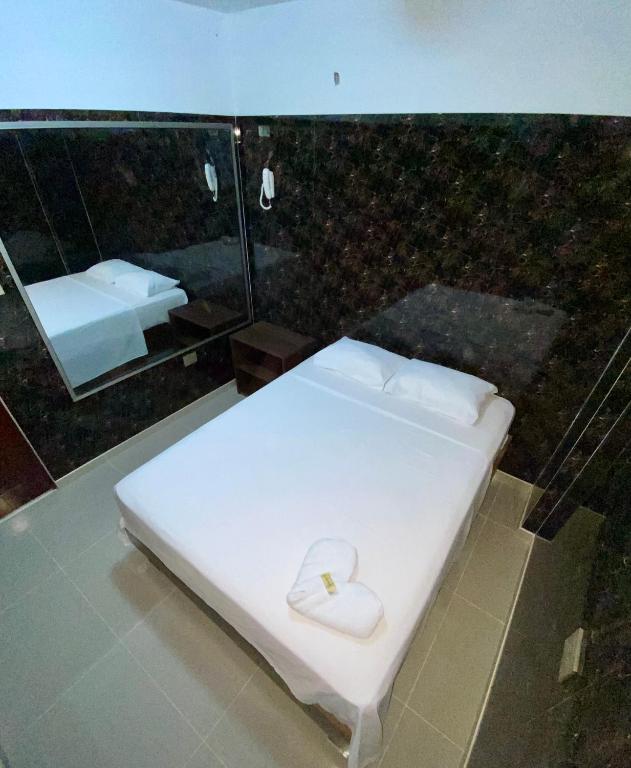 Postel nebo postele na pokoji v ubytování Hotel Rancho Grande
