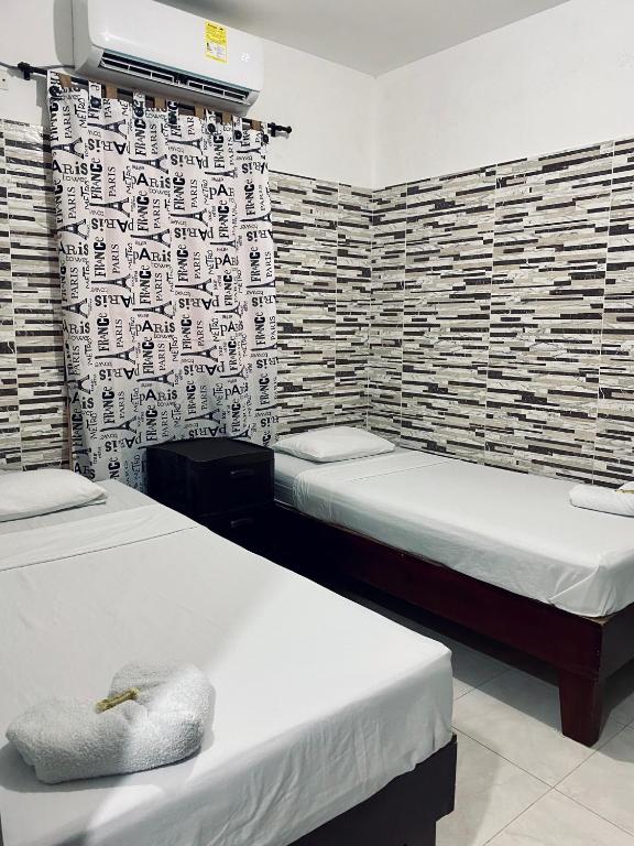 Postel nebo postele na pokoji v ubytování Hotel Rancho Grande