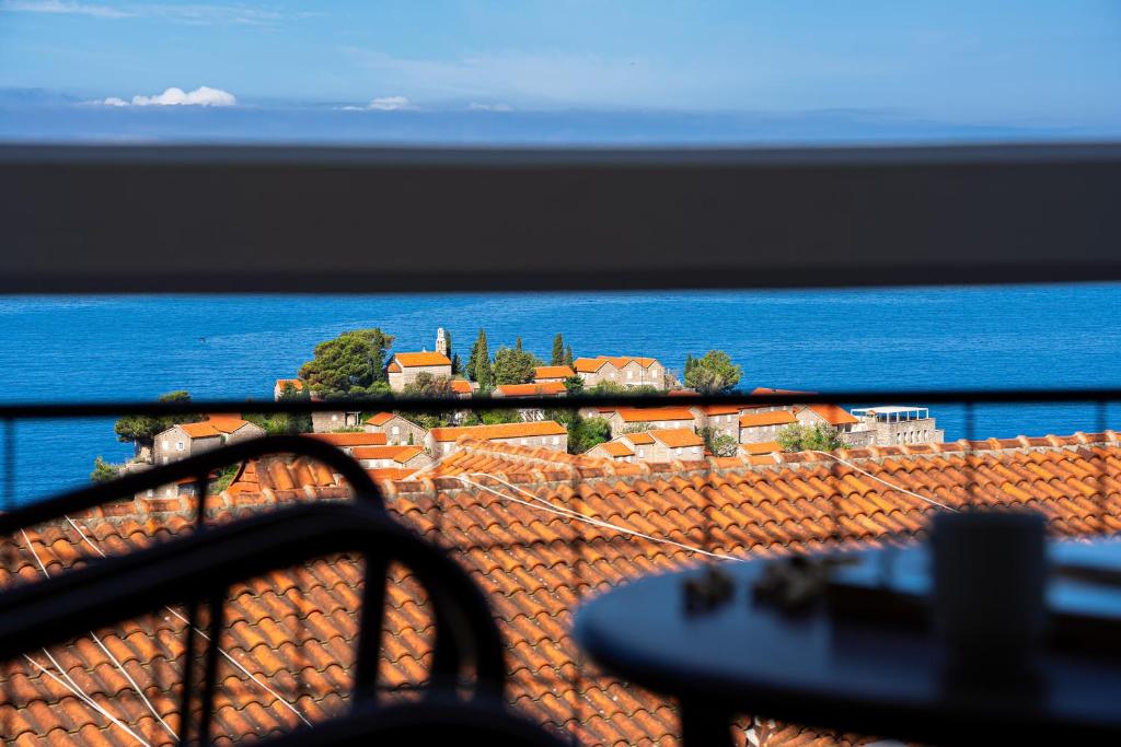 a view of the ocean from a balcony at Hotel Adrović in Sveti Stefan