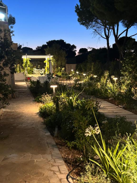 a garden at night with lights at Villa Jobè in Polignano a Mare