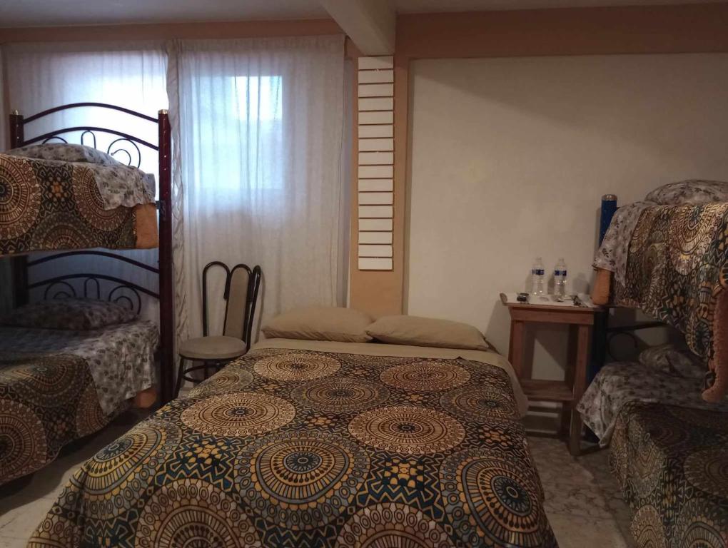 Postel nebo postele na pokoji v ubytování Posada Lindavista