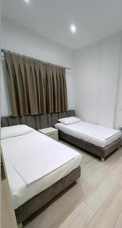 Postel nebo postele na pokoji v ubytování Hotel LIDI