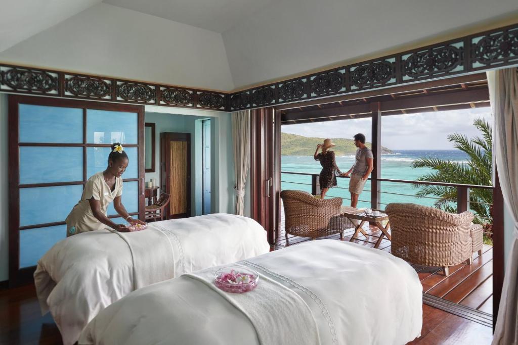 Postel nebo postele na pokoji v ubytování Mandarin Oriental, Canouan