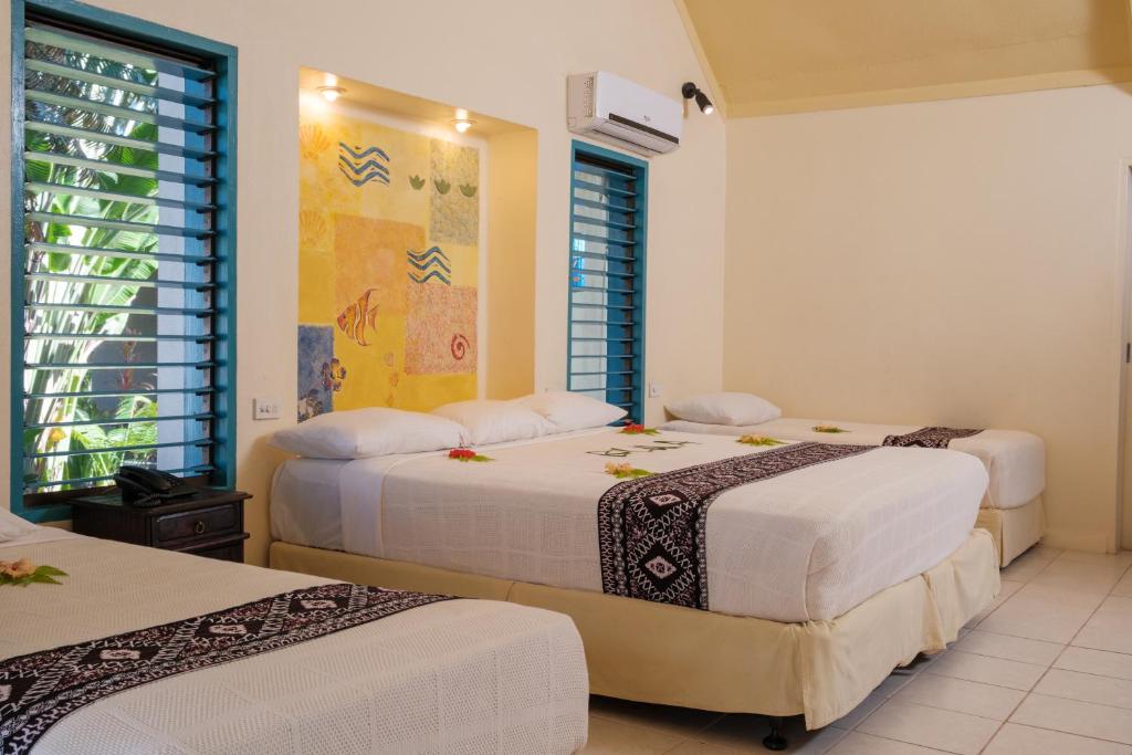 Postel nebo postele na pokoji v ubytování Fiji Hideaway Resort & Spa