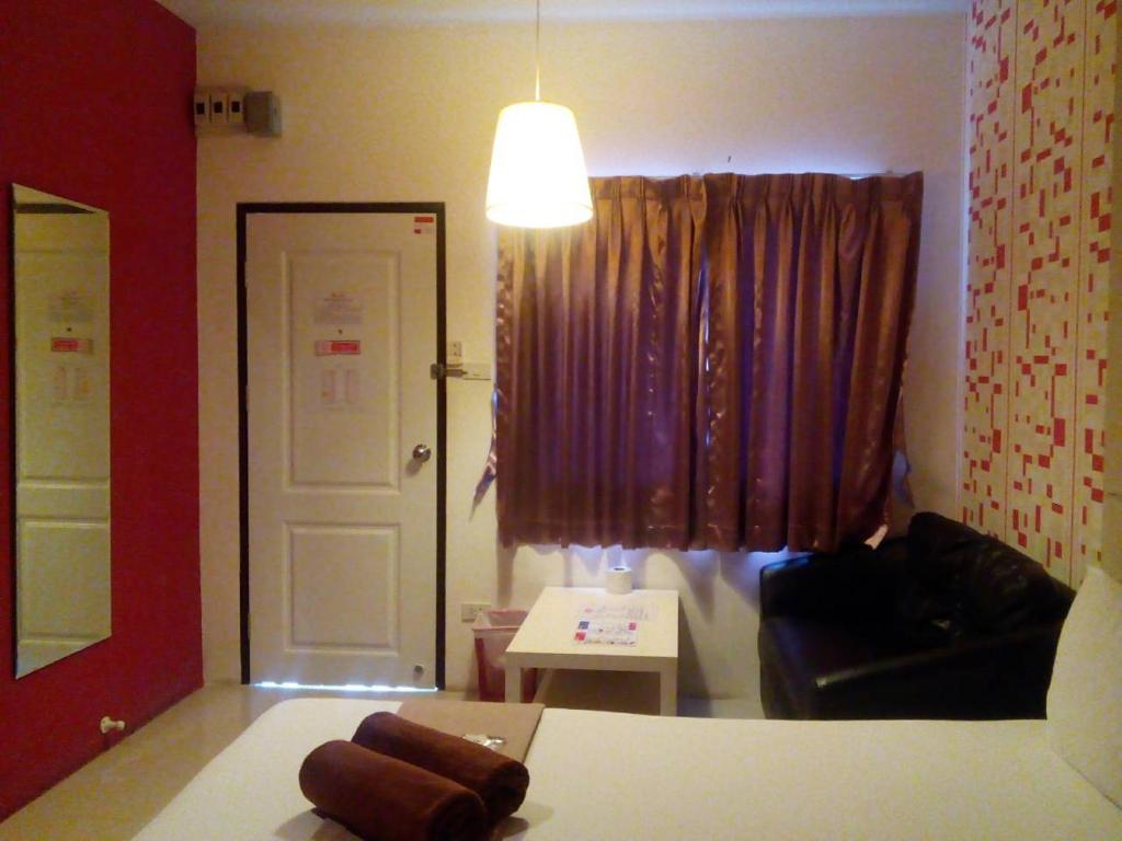 Postel nebo postele na pokoji v ubytování Bearing26 Hotel
