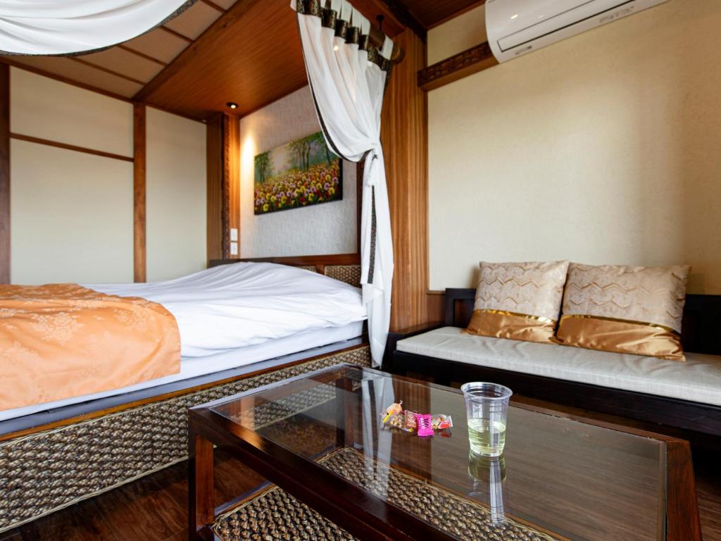 Postel nebo postele na pokoji v ubytování Bali Resort SAYA no Kaze