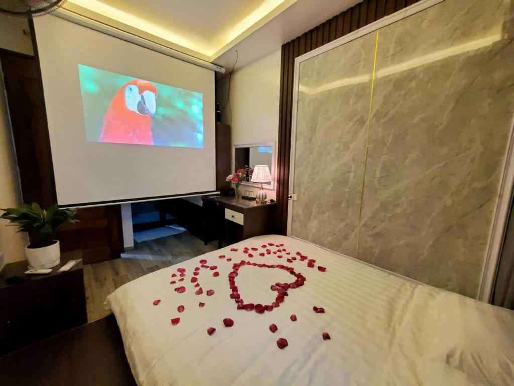 Postel nebo postele na pokoji v ubytování Hanoian Hotel