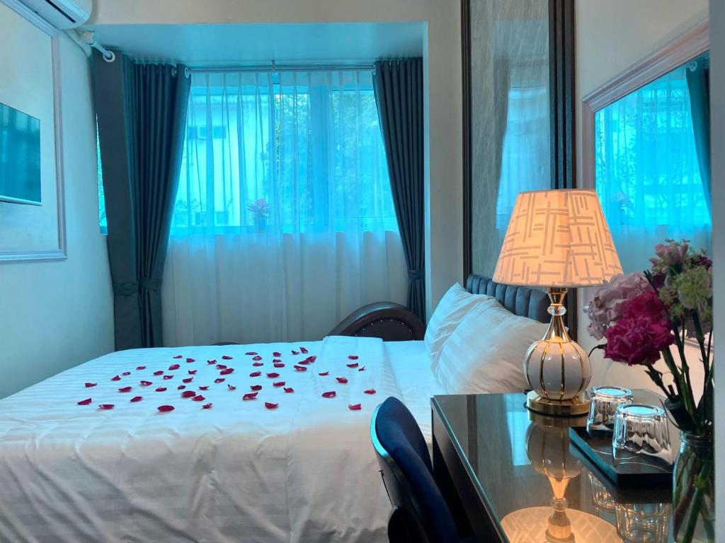 Postel nebo postele na pokoji v ubytování Hanoian Hotel
