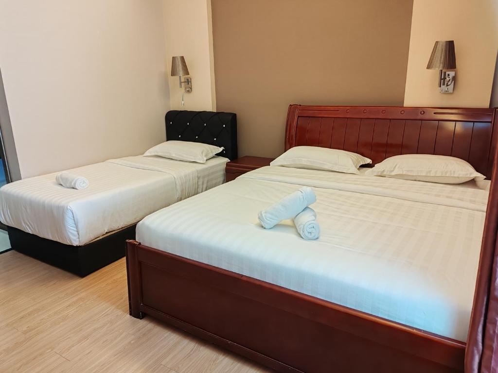 Postel nebo postele na pokoji v ubytování Hotel Prima