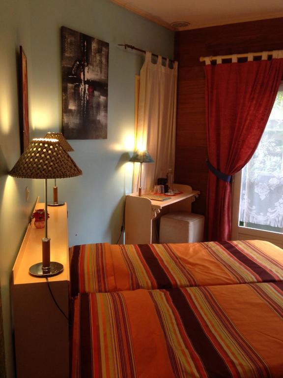 Postel nebo postele na pokoji v ubytování Pinpin D'amour