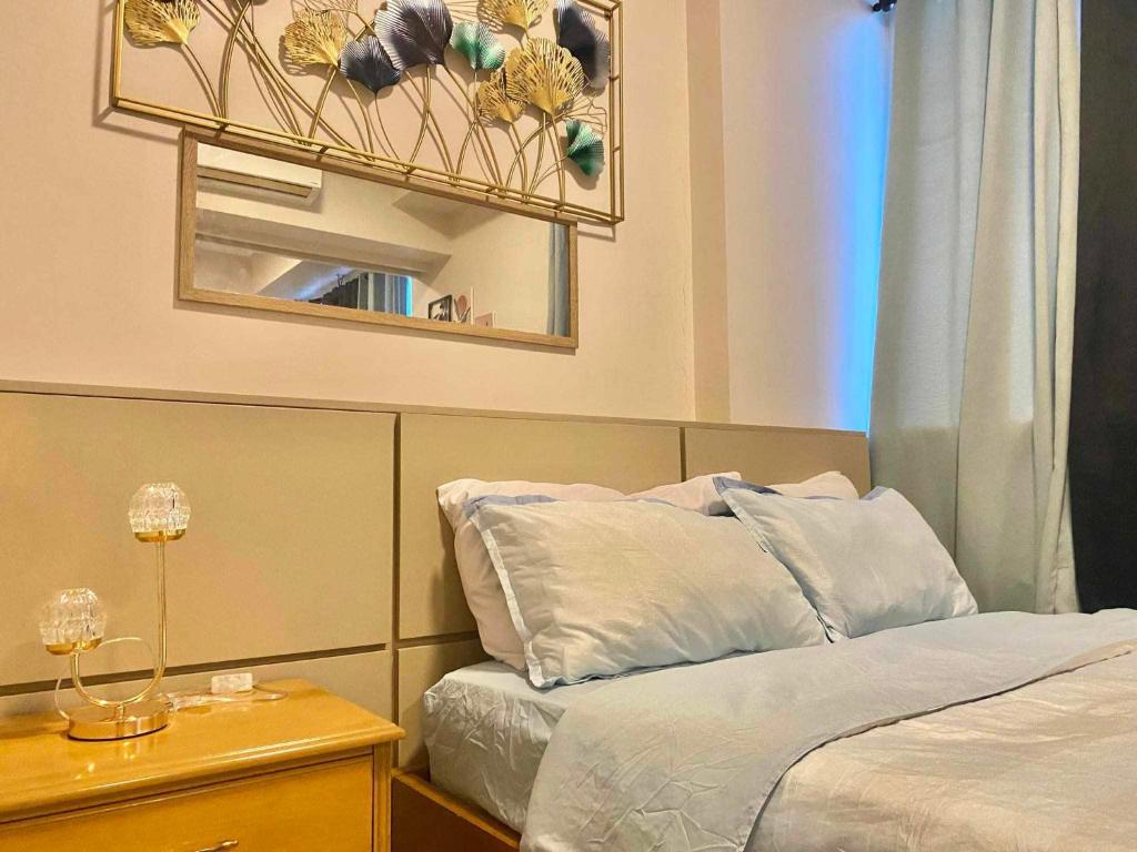 Ένα ή περισσότερα κρεβάτια σε δωμάτιο στο Mactan Newtown with seaview