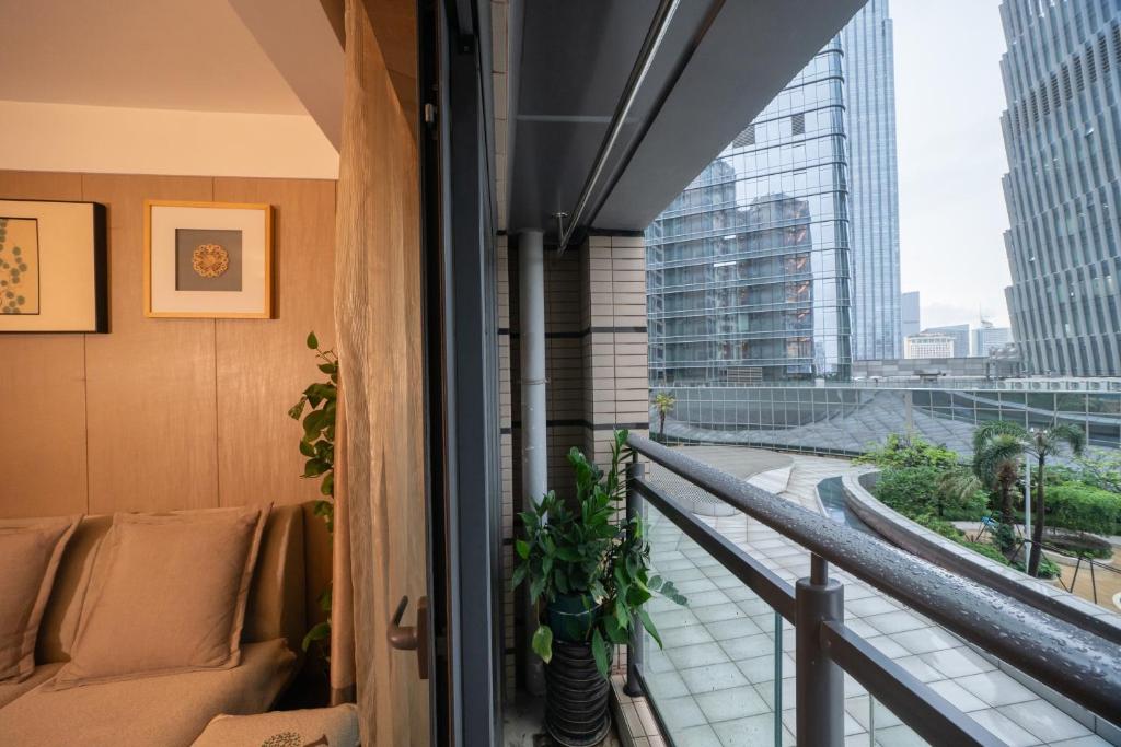 a balcony with a view of a city at Shenzhen Binhe Impression Hotel Apartments in Shenzhen