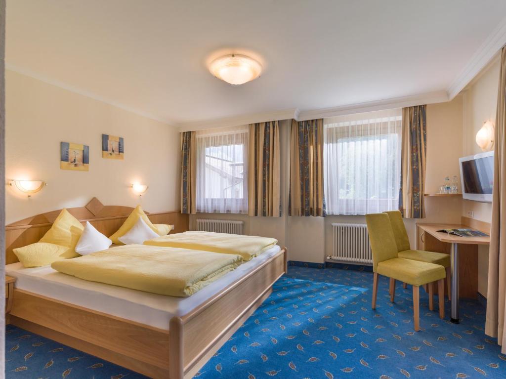 Postel nebo postele na pokoji v ubytování Zeitlos Apartments