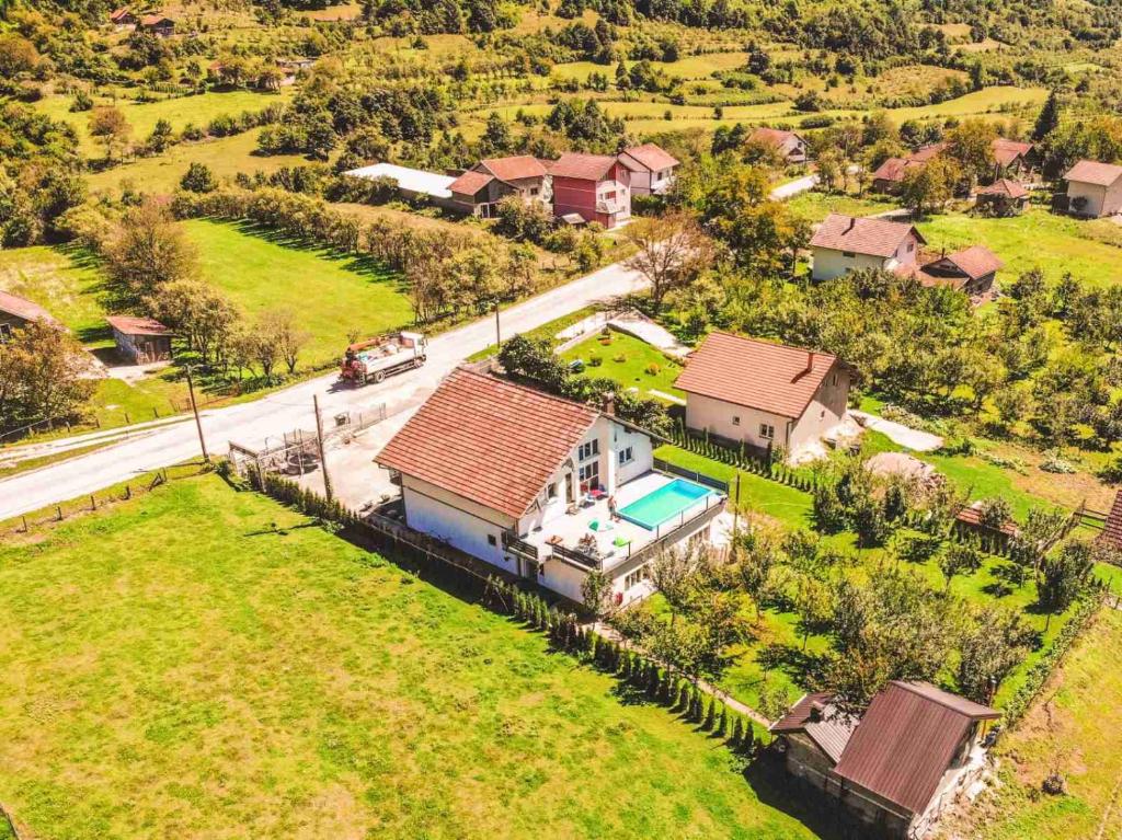 an aerial view of a house with a swimming pool at Apartments Hills in Ćukovi