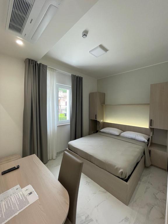 Postel nebo postele na pokoji v ubytování Hotel Diadema