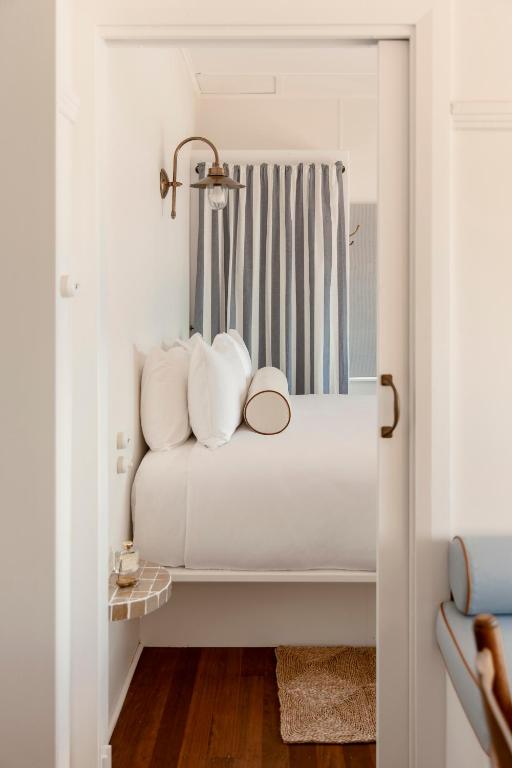 Postel nebo postele na pokoji v ubytování Il Delfino Seaside Inn