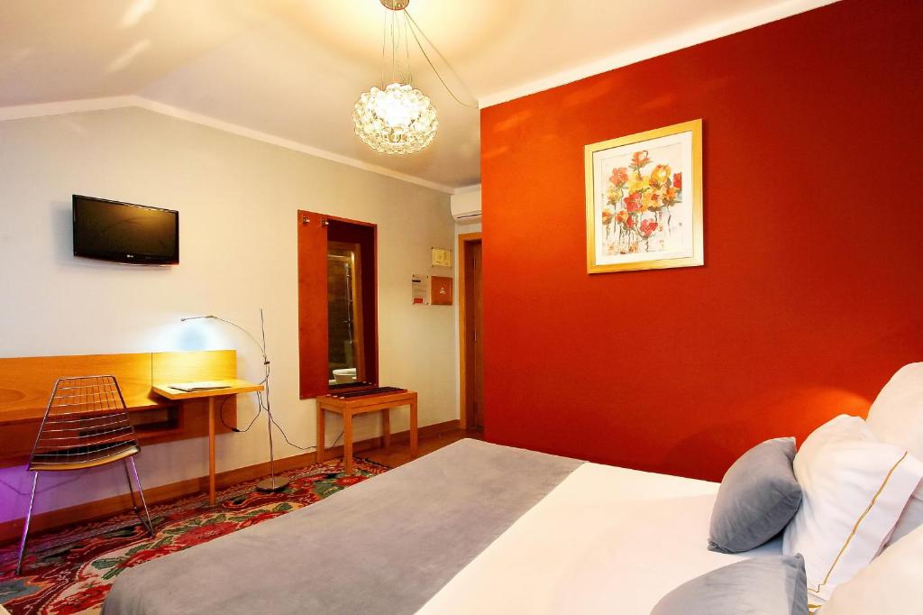 Postel nebo postele na pokoji v ubytování Hotel Mestre de Avis