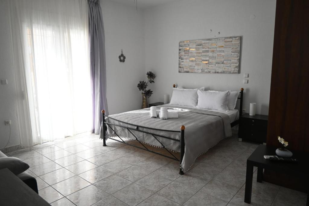 Postel nebo postele na pokoji v ubytování Doukas Aparthotel