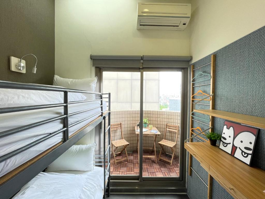 Postel nebo postele na pokoji v ubytování Easymind Guesthouse Taipei Main Station