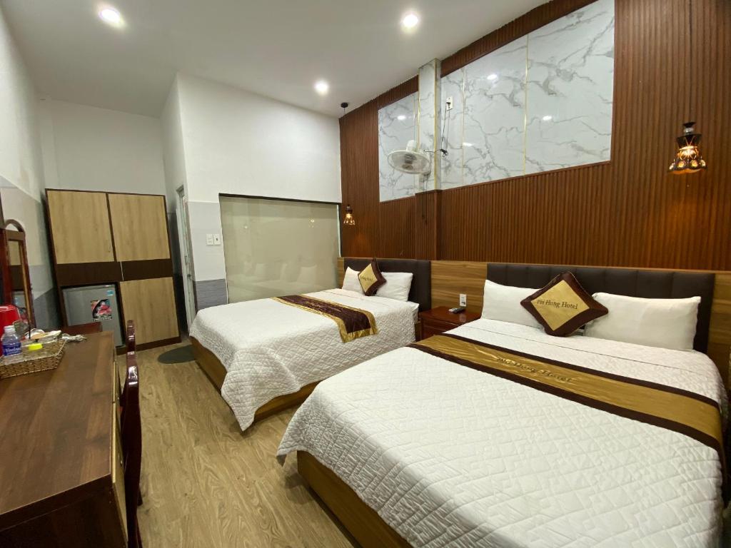 Postel nebo postele na pokoji v ubytování Hotel Phi Hùng
