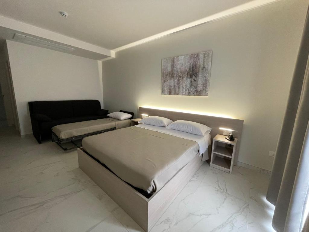 Postel nebo postele na pokoji v ubytování Hotel Diadema