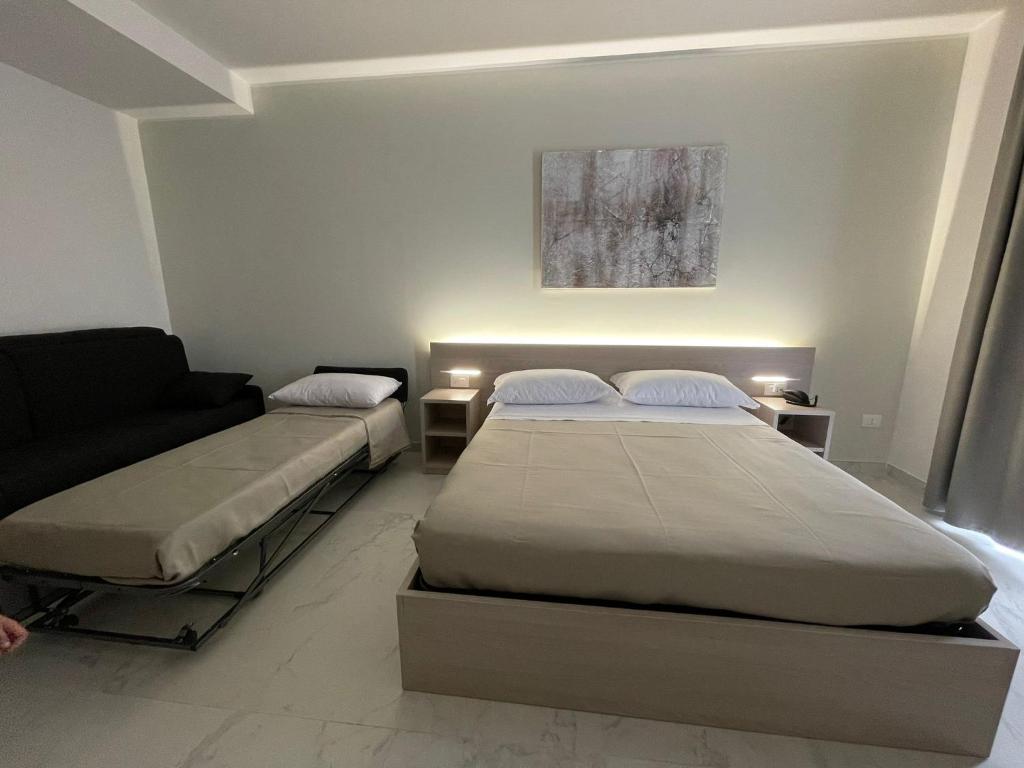 Postel nebo postele na pokoji v ubytování Hotel Diadema