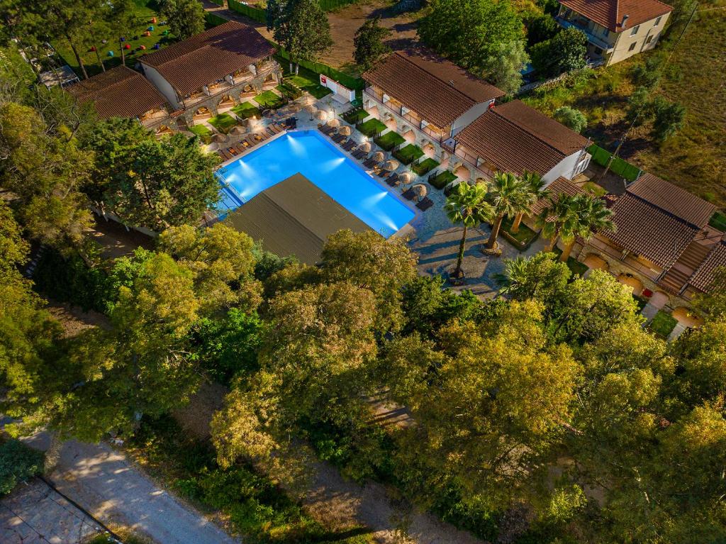 an overhead view of a swimming pool in a yard with trees at Alados Otel in Turgut