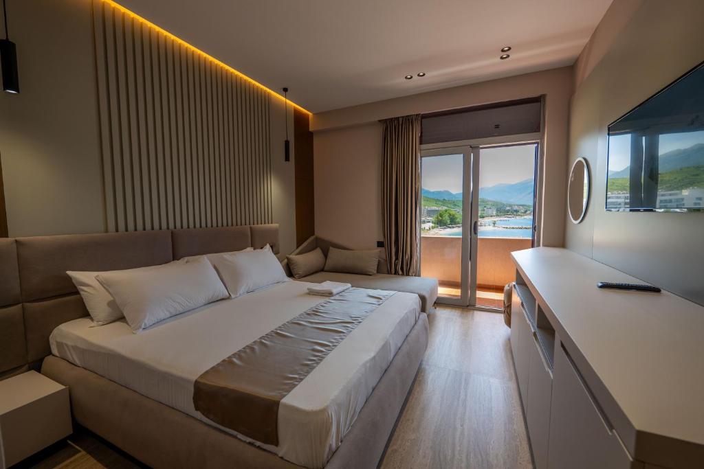 Postel nebo postele na pokoji v ubytování Grand Hotel Aita