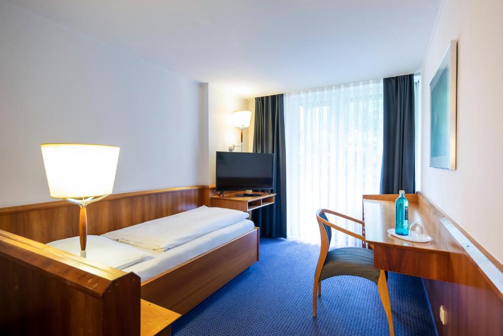 Postel nebo postele na pokoji v ubytování Roomingtons Karoli Waldkirchen