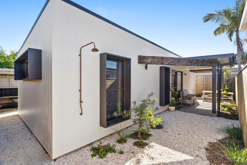 a house with a large window on the side of it at Blue Ash Studio in Lennox Head